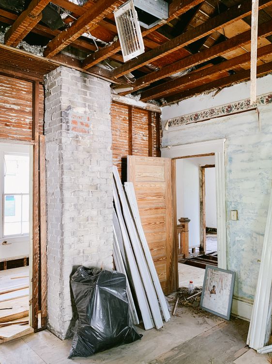 Exposed framing and brickwork inside a property undergoing renovation